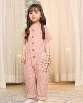 Laad`s child is wearing the adorable daisy onesie boasts a comfy round neck & wooden button front. A spacious pocket is adorned with charming hand-embroidered flowers & butterflies. Super soft fabric & a relaxed fit keep your little one happy & comfy all trip long!