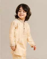 Little boy in a stylish Phulwari almond blush kurta set with delicate embroidery, showcasing festive elegance and comfort. Perfect ethnic wear for kids by laad.