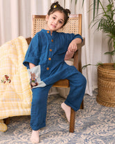 Dress your little one in LAAD's Bunny Jumpsuit, featuring a bandhgala collar, wooden buttons, and hand-embroidered Peter Rabbit details. Elegant, playful, and travel-ready!