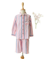 LAAD`S boy wearing candy stipe co-ord set, classic shirt with bermuda shorts.