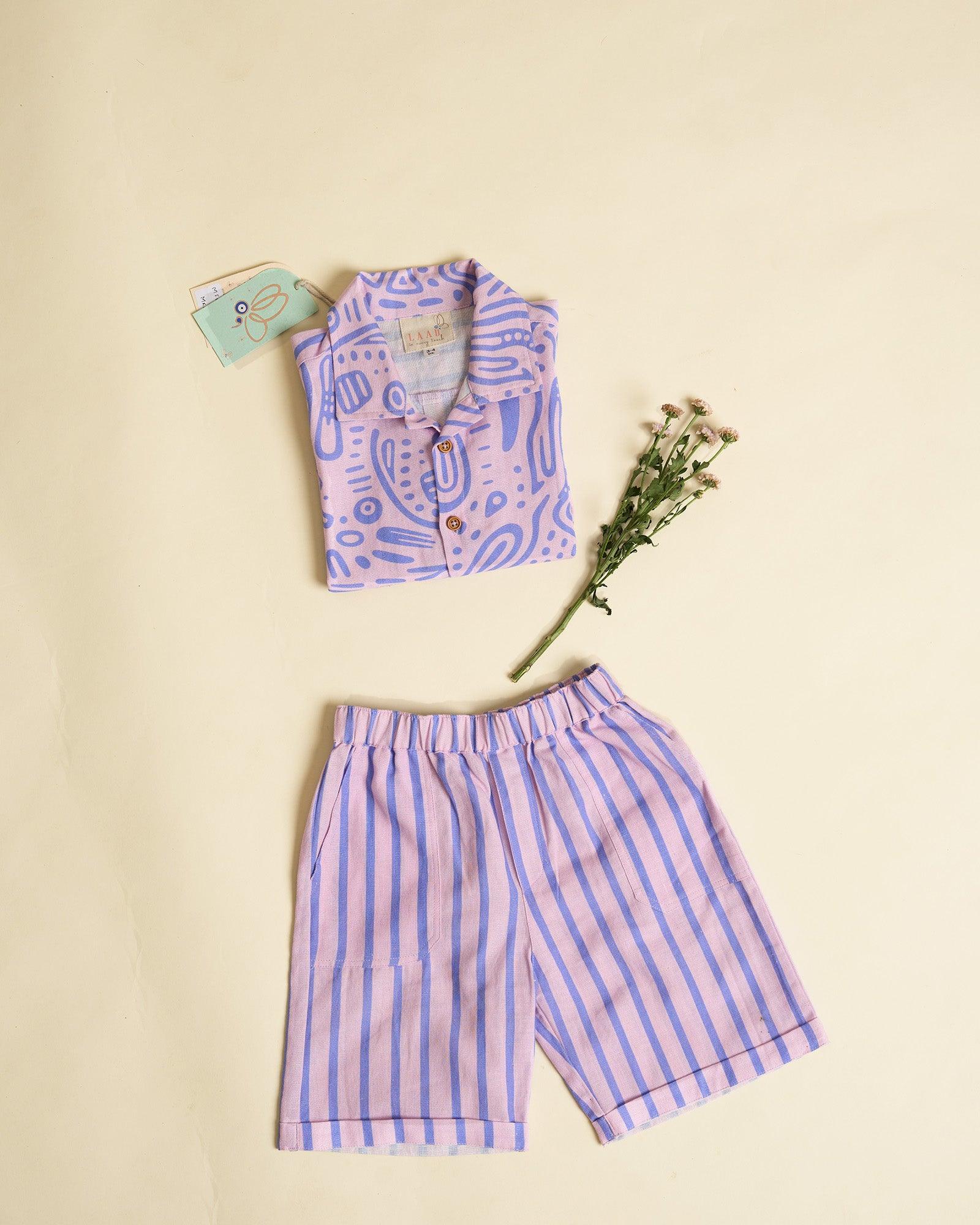 Aline fun print half-sleeve ameba shirt featuring wooden buttons and stylish strips Bermuda shorts. a perfect co-ord set of kids summer shirt sand shorts