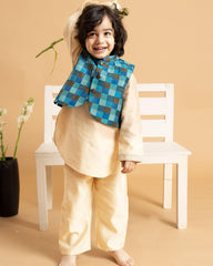 A Champion Blush Kurta Pyjama Set featuring a luxurious silk Chanderi waistcoat with an azure blue and mocha check pattern. The kurta boasts intricate embroidery, a classic bandhgala collar, detailed placket, and finely crafted sleeve accents, creating an elegant and coordinated look for festive occasions.