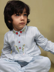 Baby blue bun bandhgala kurta pyjama set   features intricate hand embroidery around the placket and collar with a delightful Bluey motif and shimmering mirror glare details. Fun, colorful buttons add a playful touch, while solid elastic pyjamas ensure comfort and a secure fit.