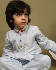 Baby blue bun bandhgala kurta pyjama set   features intricate hand embroidery around the placket and collar with a delightful Bluey motif and shimmering mirror glare details. Fun, colorful buttons add a playful touch, while solid elastic pyjamas ensure comfort and a secure fit.