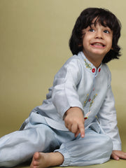 Baby blue bun bandhgala kurta pyjama set   features intricate hand embroidery around the placket and collar with a delightful Bluey motif and shimmering mirror glare details. Fun, colorful buttons add a playful touch, while solid elastic pyjamas ensure comfort and a secure fit