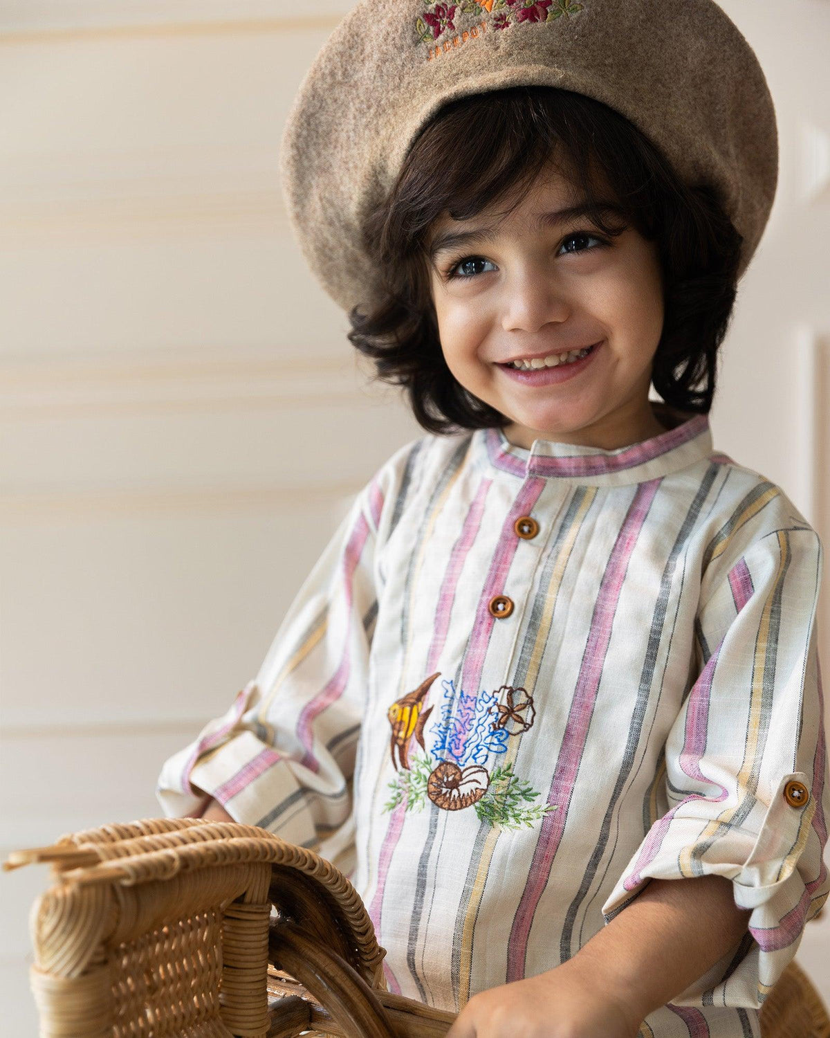  Embrace the ocean! Our Big fat fish-embroidered kurta features a classic cut & hand-crafted sea details. Wooden buttons & roll-up sleeves add a touch of modern whimsy. Breathable & eco-friendly!