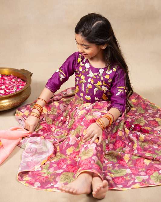 Little girl in a vibrant bulbul voilet bagh lehenga with dupatta featuring  floral print set with  purple embroidered blouse, three-quarter sleeves, paired  peach dupatta – festive ethnic outfit for kids by LAAD