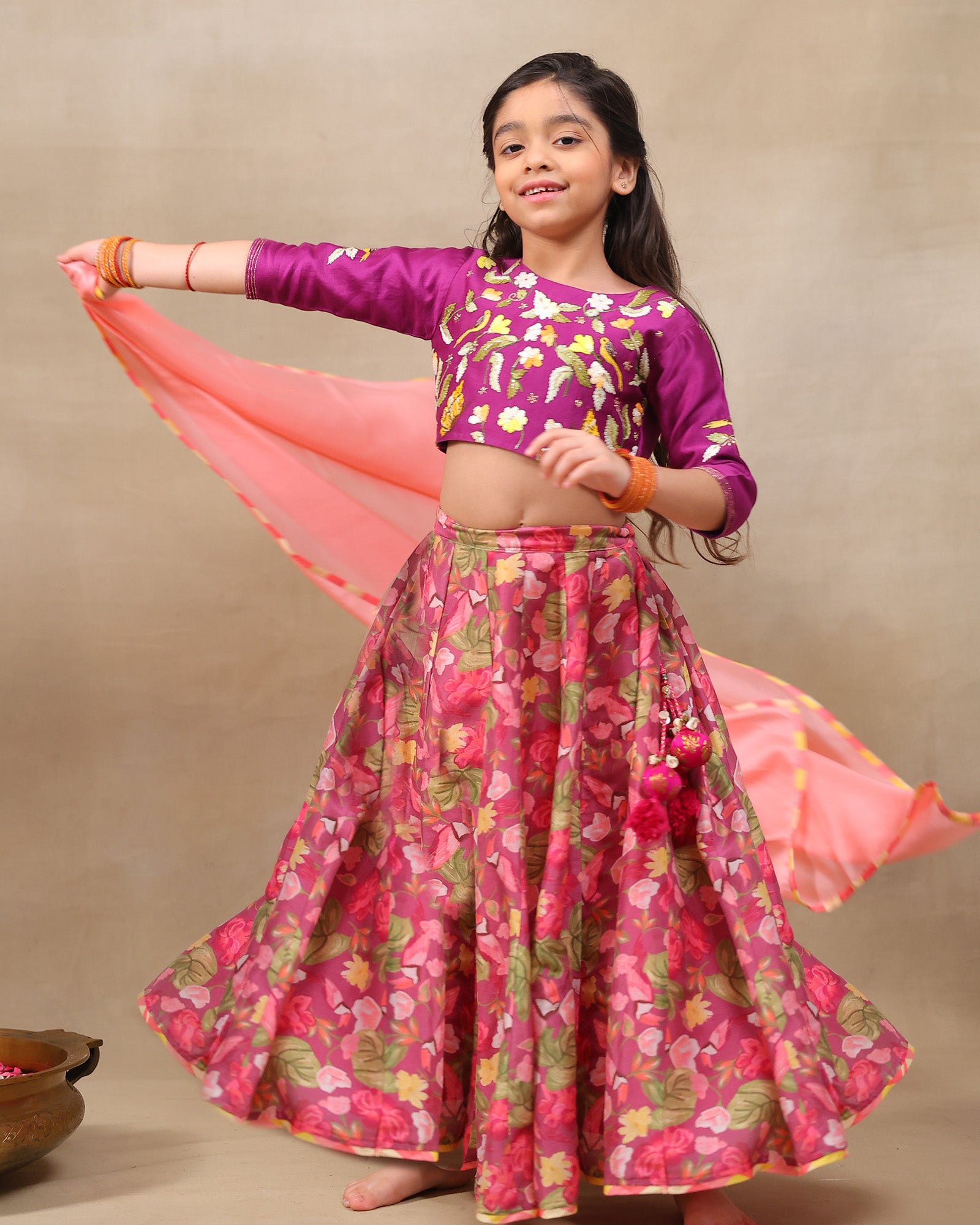 Little girl in a vibrant bulbul voilet bagh lehenga with dupatta featuring  floral print set with  purple embroidered blouse, three-quarter sleeves, paired  peach dupatta – festive ethnic outfit for kids by LAAD