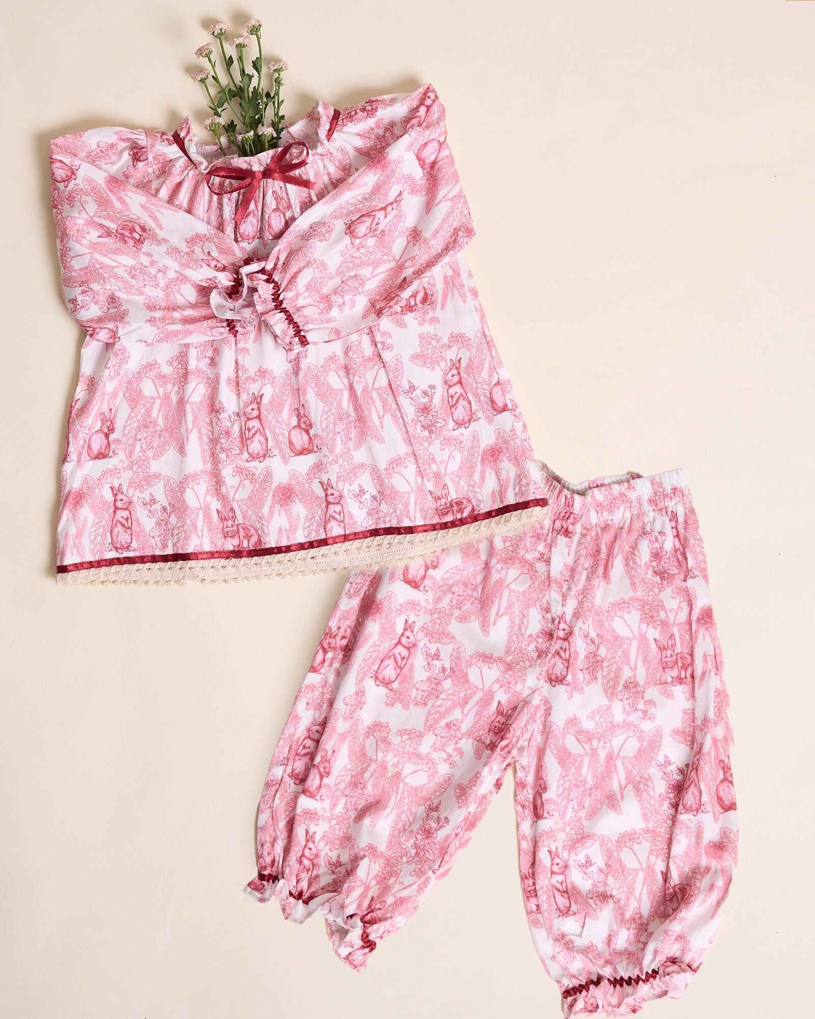 Indulge in timeless elegance with our Victorian-inspired toile rabbit print co-ord set. Featuring lace trims, frilled sleeves, and pleated hems, it blends vintage charm with comfort.
