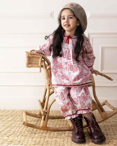 Indulge in timeless elegance with our Victorian-inspired toile rabbit print co-ord set. Featuring lace trims, frilled sleeves, and pleated hems, it blends vintage charm with comfort.
