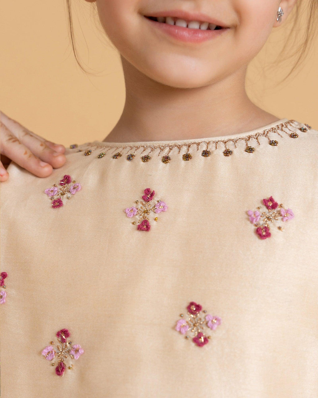LAAD Kids' Cream Embroidered Kurta Set – a delicate floral kurta with pastel checkered Patiala and a sheer pink dupatta for a festive charm.