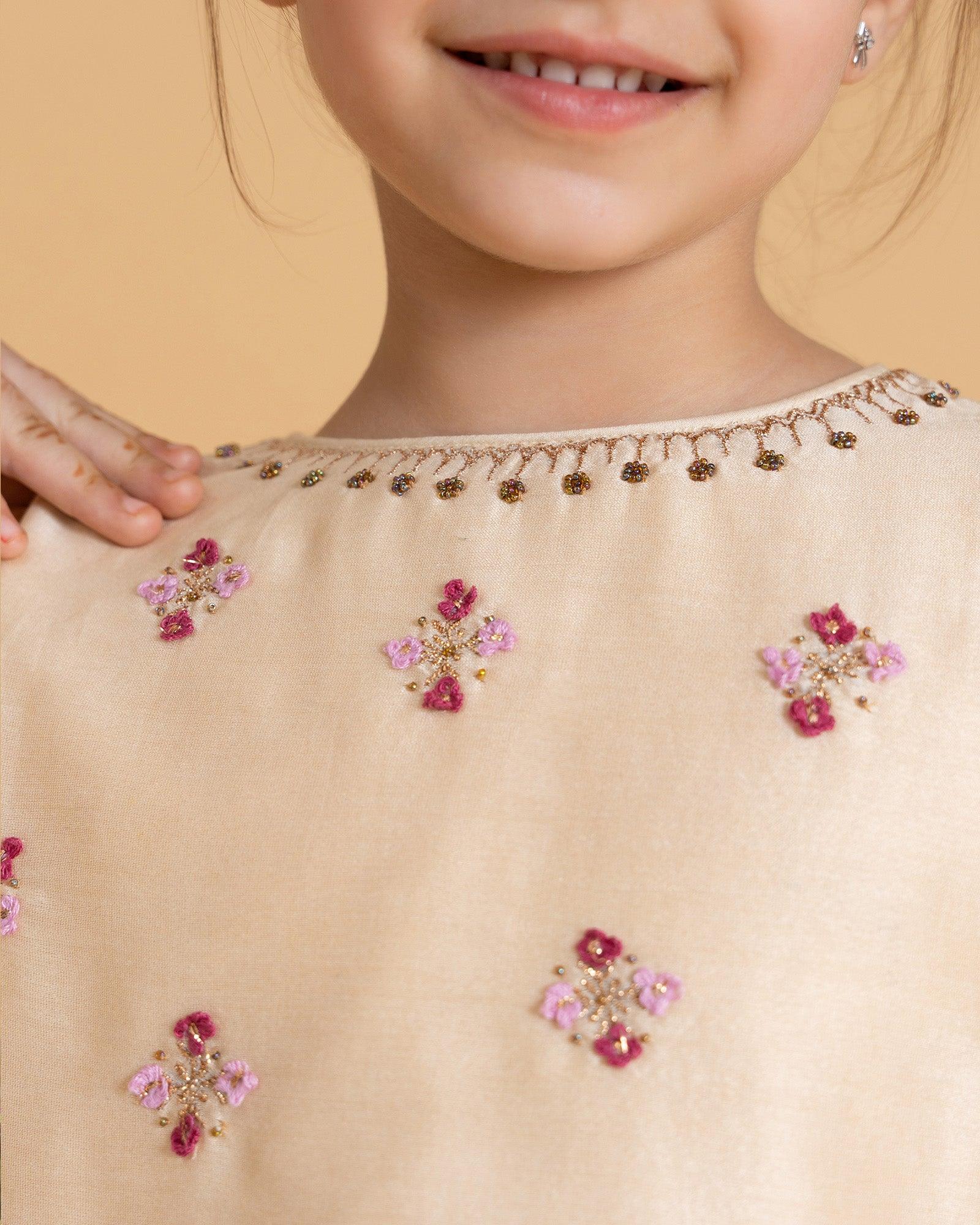 LAAD Kids' Cream Embroidered Kurta Set – a delicate floral kurta with pastel checkered Patiala and a sheer pink dupatta for a festive charm.