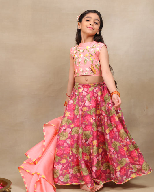 Girl in festive pink floral lehenga set with embroidered crop top – handcrafted kids ethnic wear by LAAD