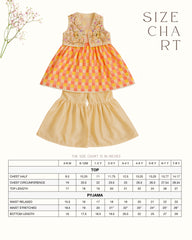 Girl wearing the Zinnia Sharara Set, featuring a vibrant checkered kurta with embroidered and printed jacket detailing along with flared and golden sharara pants, perfect for festive occasions.