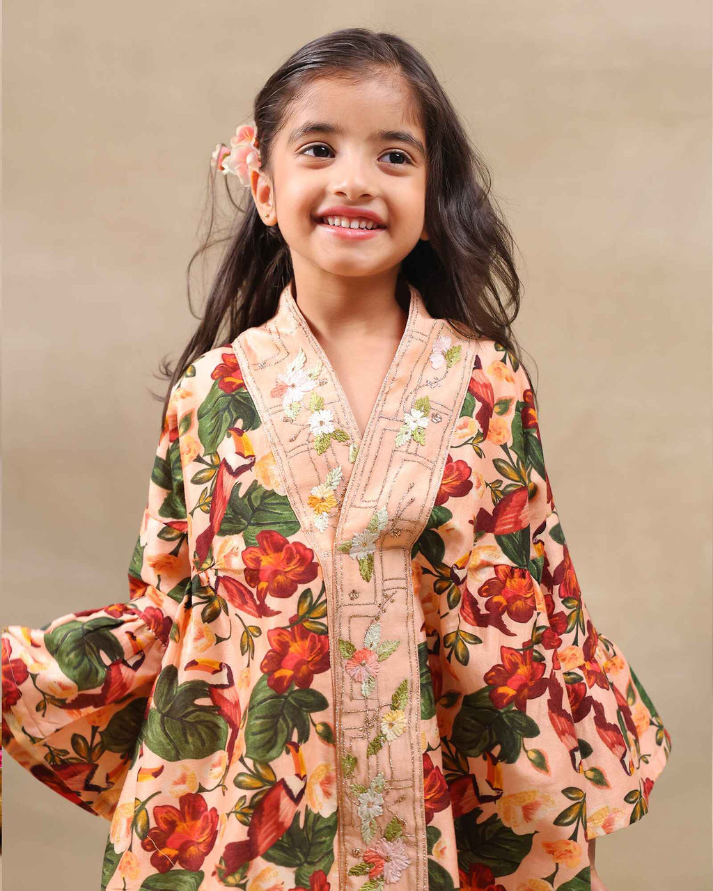 Girl wearing GLUBAGH PEACH SHARARA a handcrafted floral red kimono style top with embroidered neckline and flared ivory sharara pants – its perfect traditional kurta pyjama , kids ethnic wear by LAAD
