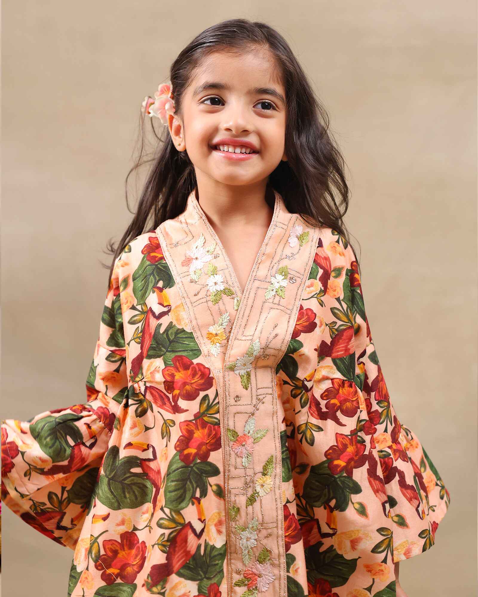 Girl wearing GLUBAGH PEACH SHARARA a handcrafted floral red kimono style top with embroidered neckline and flared ivory sharara pants – its perfect traditional kurta pyjama , kids ethnic wear by LAAD