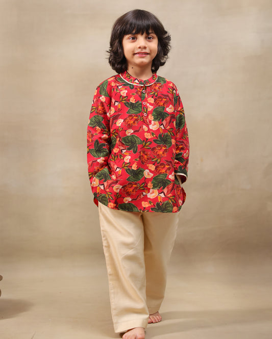 Young boy wearing a gulbagh kurta pyjama set with buttoned neckline and ivory straight pants – festive traditional kidswear by LAAD