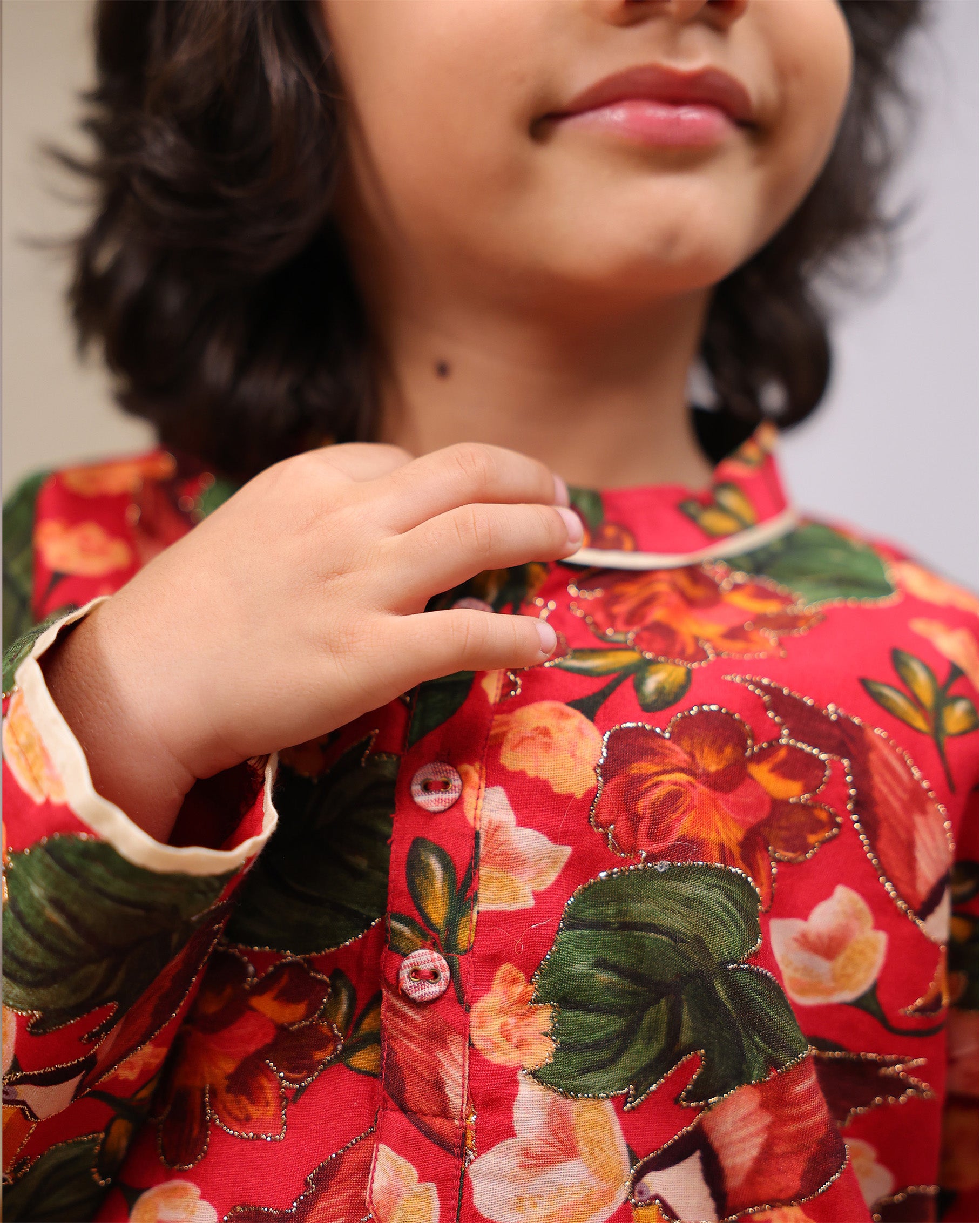 Young boy wearing a gulbagh kurta pyjama set with buttoned neckline and ivory straight pants – festive traditional kidswear by LAAD