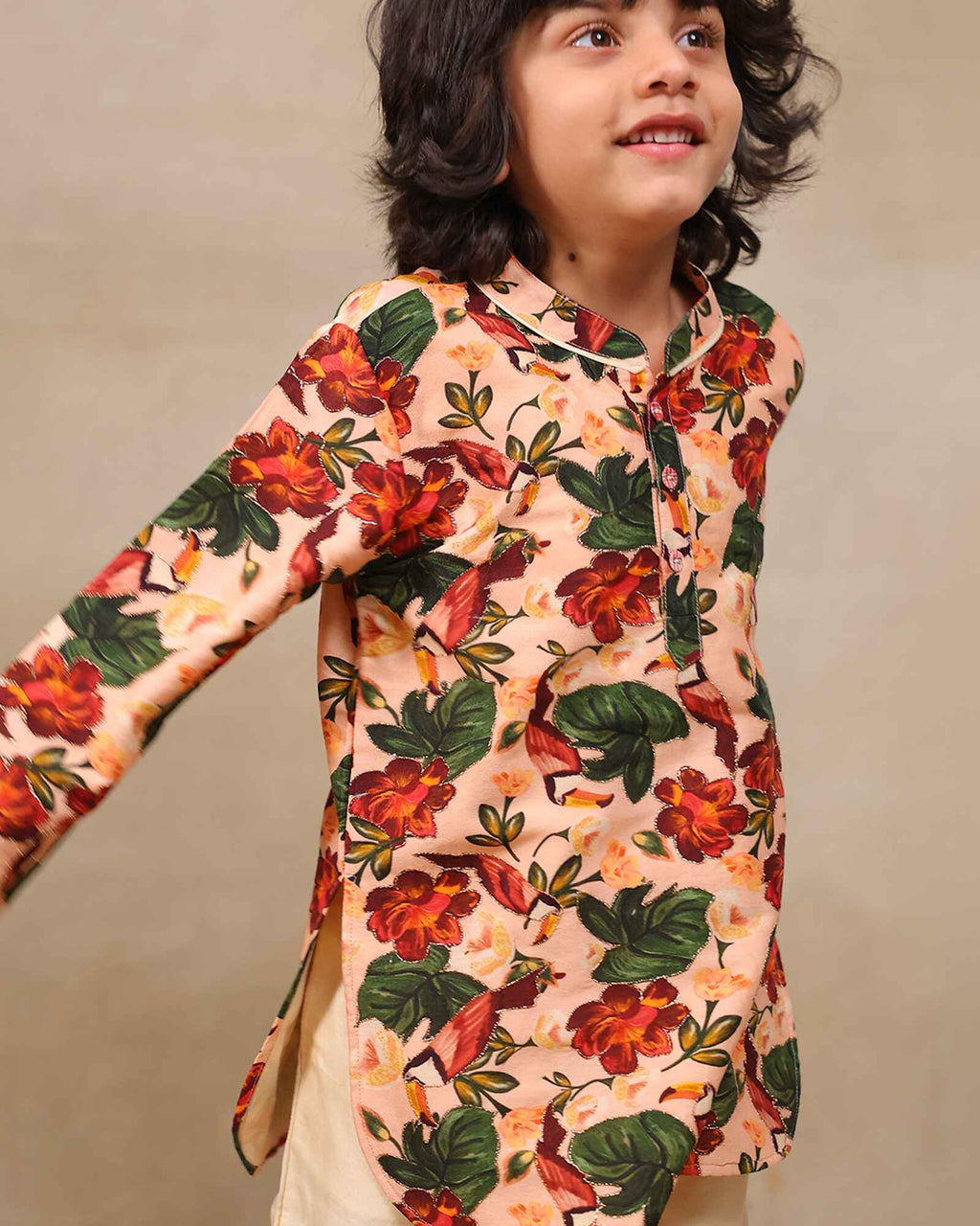 Laad`s Child wearing a floral print gul bagh peach kurta pyjama set full-sleeve embroidered kurta set, perfect festive wear for boys . Handcrafted in laadindia best kids wear shops in india.x