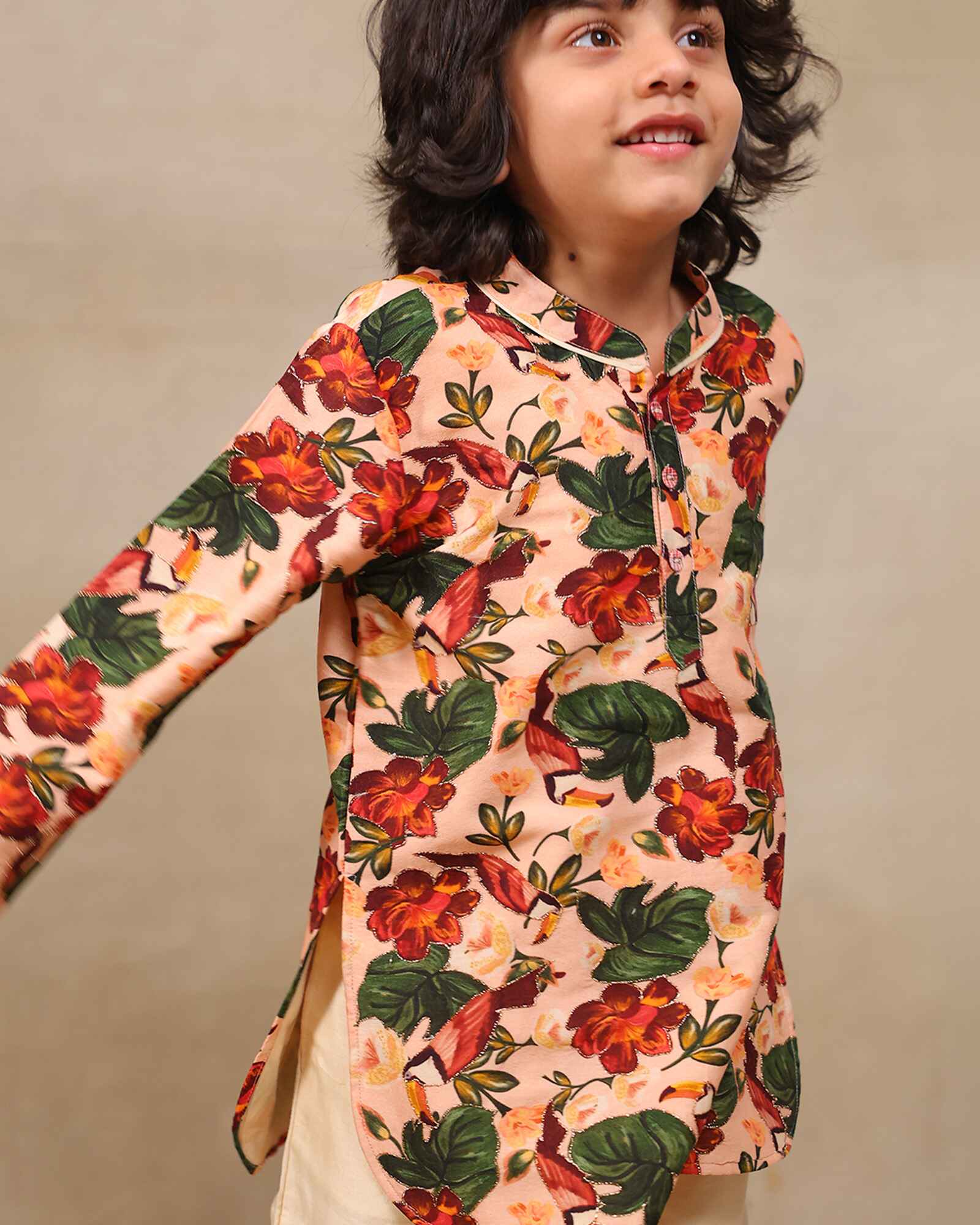 Laad`s Child wearing a floral print gul bagh peach kurta pyjama set full-sleeve embroidered kurta set, perfect festive wear for boys . Handcrafted in laadindia best kids wear shops in india.x