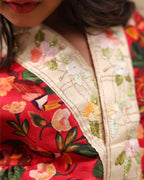 Girl wearing a handcrafted floral red kimono style party wear sharara with embroidered neckline and paired with  flared ivory sharara pants – perfect girls festive kidswear, occasion and celebration wear by LAADindia.