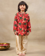 Young boy wearing a gulbagh kurta pyjama set with buttoned neckline and ivory straight pants – festive traditional kidswear by LAAD