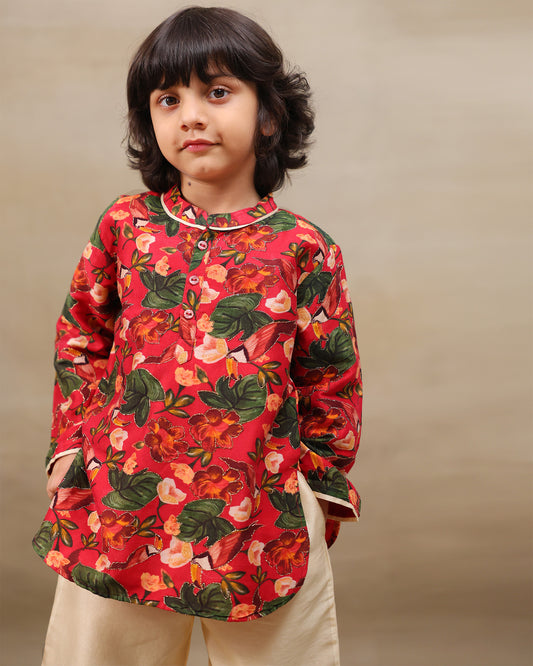 Young boy wearing a gulbagh kurta pyjama set with buttoned neckline and ivory straight pants – festive traditional kidswear by LAAD