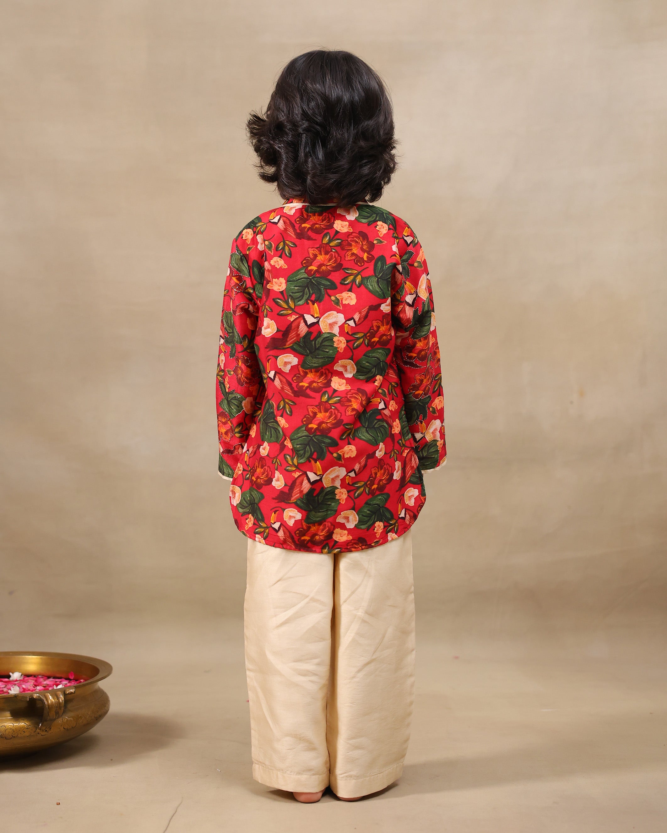 Young boy wearing a gulbagh kurta pyjama set with buttoned neckline and ivory straight pants – festive traditional kidswear by LAAD