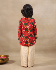 Young boy wearing a gulbagh kurta pyjama set with buttoned neckline and ivory straight pants – festive traditional kidswear by LAAD