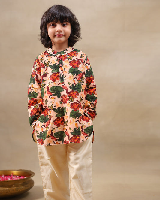 Laad`s Child wearing a floral full-sleeve kurta pyjama set, beige pyjama  with pocket kurta with badla work all over

