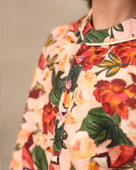 Laad`s Child wearing a floral full-sleeve kurta pyjama set, beige pyjama  with pocket kurta with badla work all over