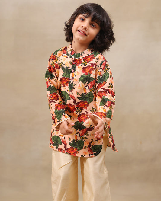 Laad`s Child wearing a floral full-sleeve kurta pyjama set, beige pyjama  with pocket kurta with badla work all over