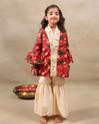 Girl wearing a handcrafted floral red kimono style party wear sharara with embroidered neckline and paired with  flared ivory sharara pants – perfect girls festive kidswear, occasion and celebration wear by LAADindia.