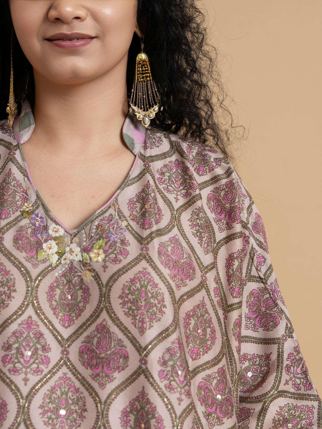 Phulwari's kaftan: V-neck & ambi-inspired print. Delicate embroidery, sleeve details. Flowing checkered palazzos. Comfy & stylish perfect festive wear