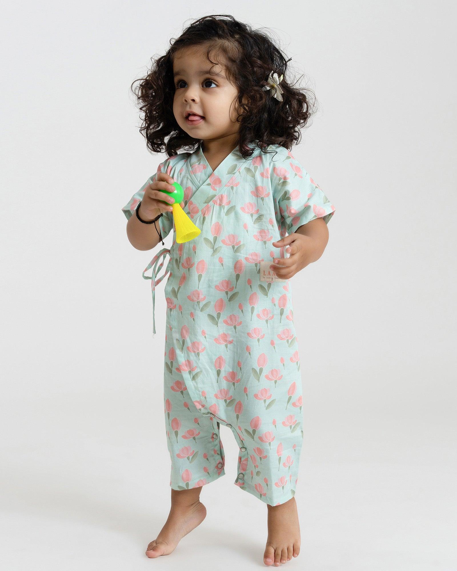 Sustainable adorable mint green tulip kimono romper is a delightful one-piece outfit, designed to capture the essence of a meadow in full bloom. This mint green kimono-style design, adjustable straps, and 100% cotton fabric. Made in India made in India with care by Laad in Every Touch.