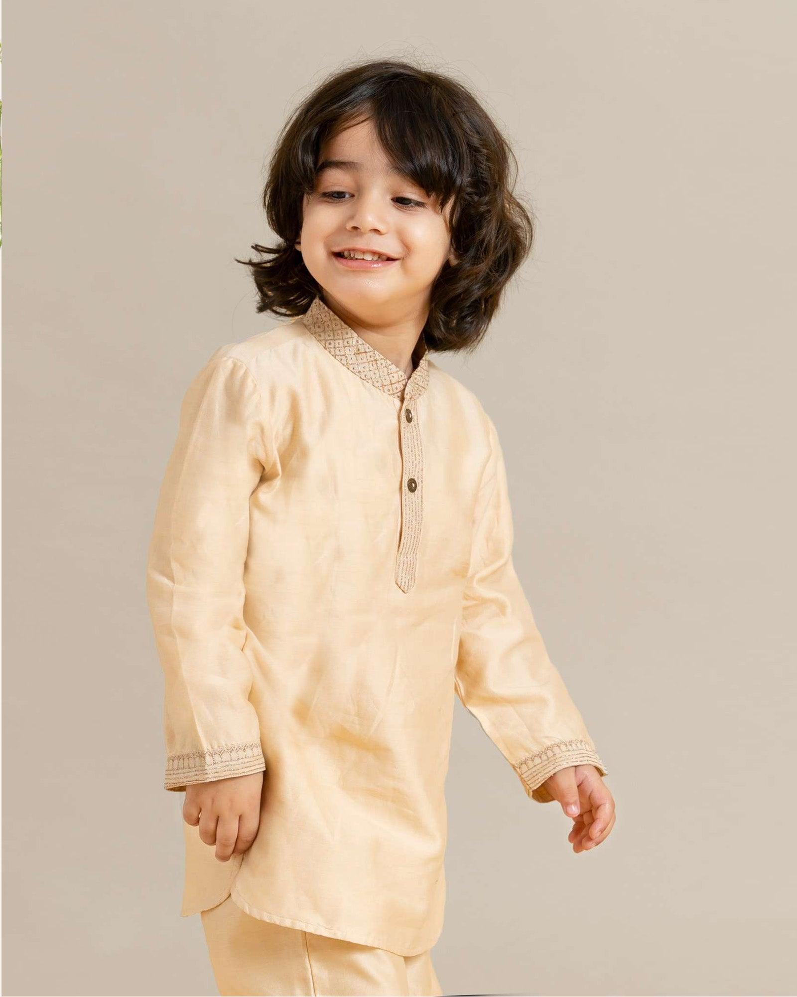 Little boy in a stylish Phulwari almond blush kurta set with delicate embroidery, showcasing festive elegance and comfort. Perfect ethnic wear for kids by laad.