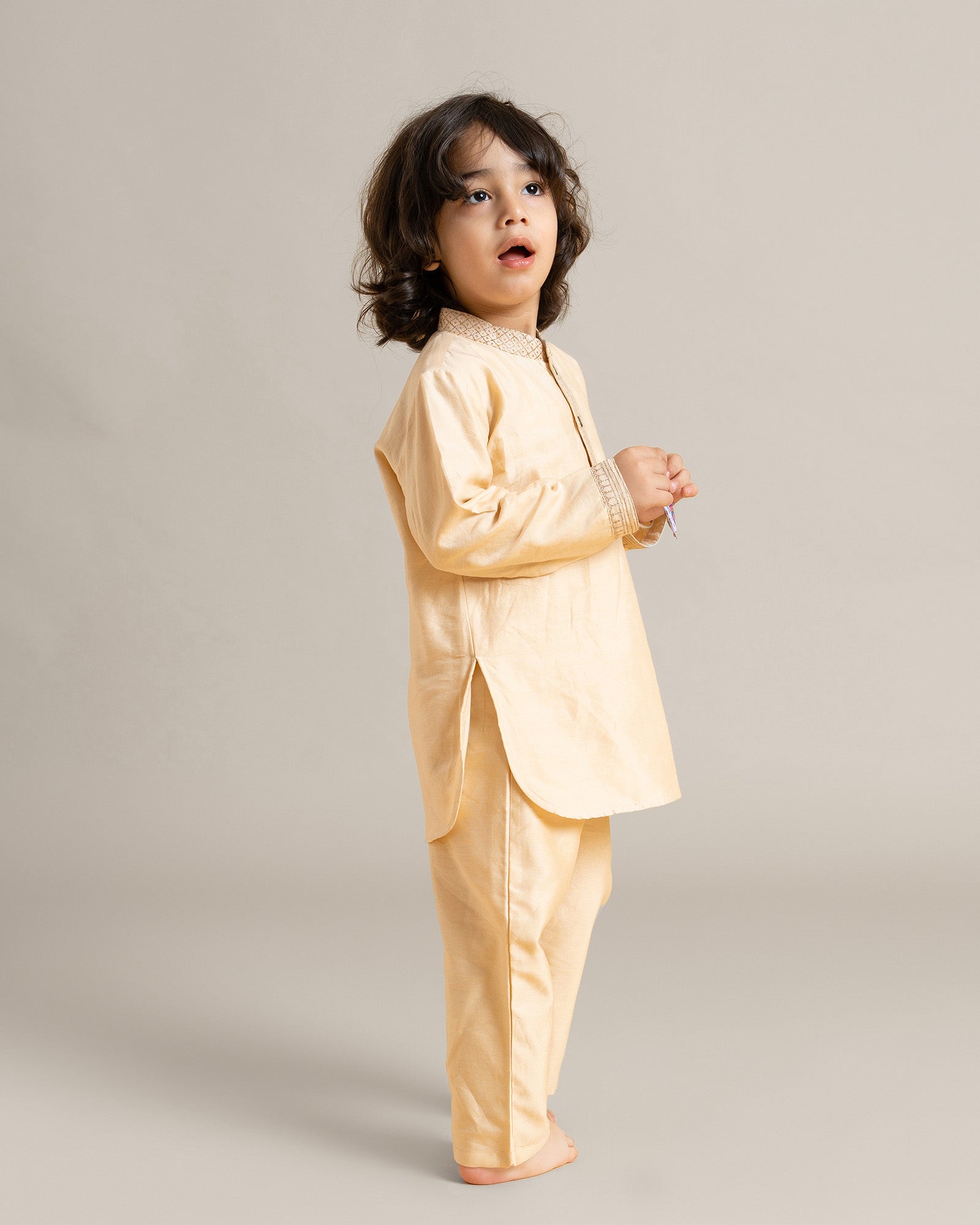 Laad's festive kurta set! Royal bandhgala, phulwari almond blush kurta pyjama with traditional badla work. Soft cotton lining for comfort.