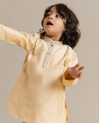 Little boy in a stylish Phulwari almond blush kurta set with delicate embroidery, showcasing festive elegance and comfort. Perfect ethnic wear for kids by laad.