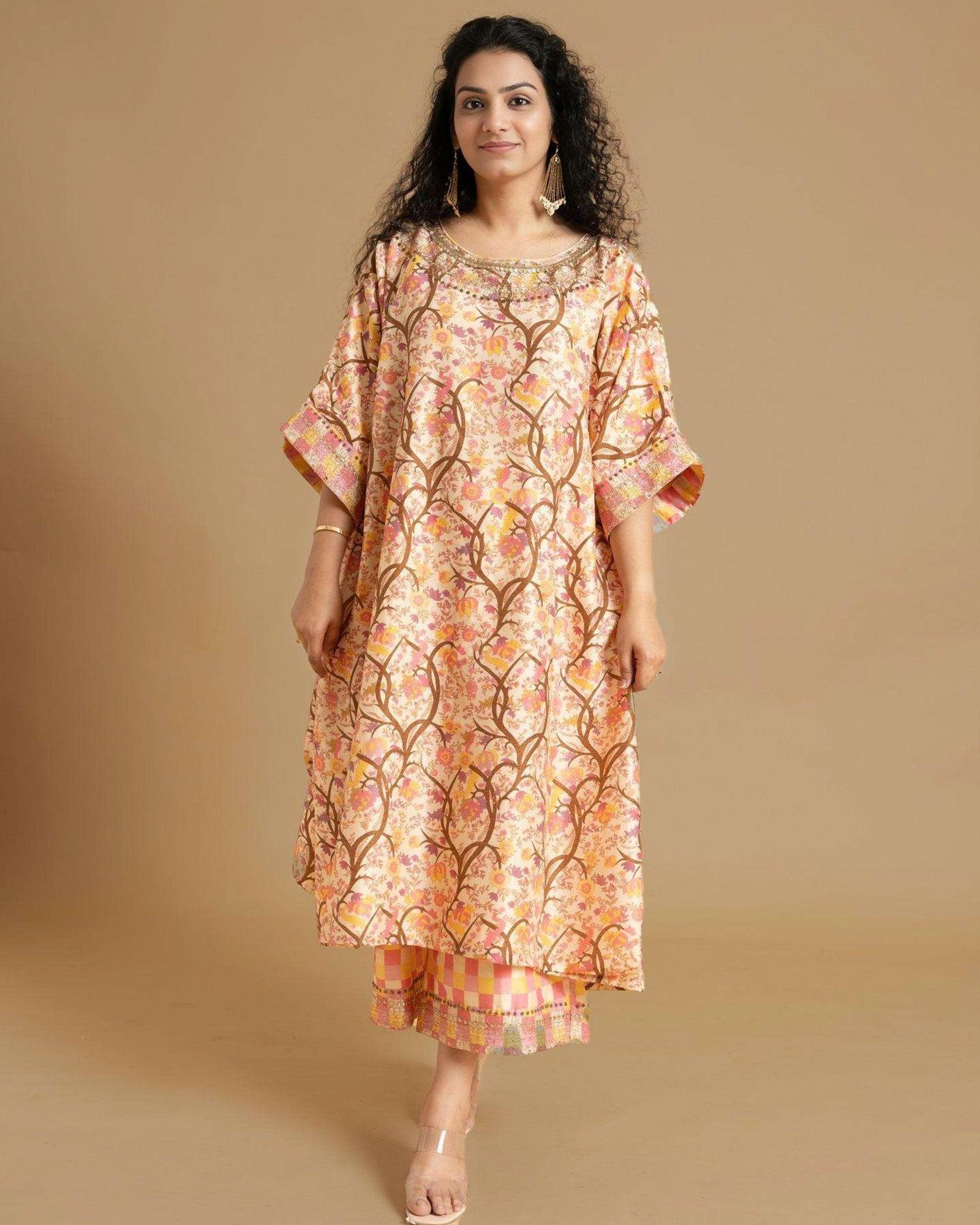 Capture spring's essence! Our Phulwari shades of spring kaftan (free size, boat neck) boast a blossom print & delicate embroidery. Flowing checkered palazzos graze the ankle.