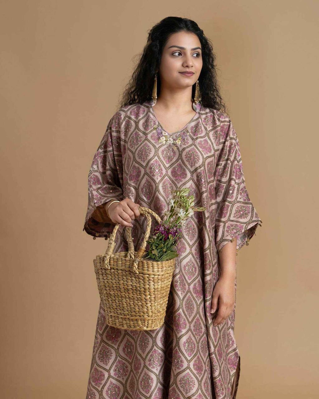 Phulwari's kaftan: V-neck & ambi-inspired print. Delicate embroidery, sleeve details. Flowing checkered palazzos. Comfy & stylish perfect festive wear