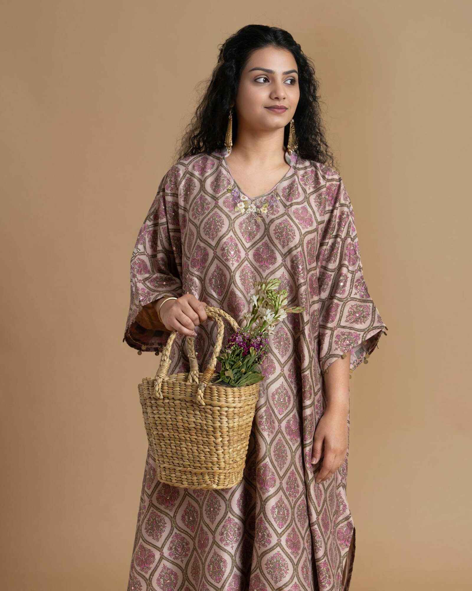 Phulwari's kaftan: V-neck & ambi-inspired print. Delicate embroidery, sleeve details. Flowing checkered palazzos. Comfy & stylish perfect festive wear