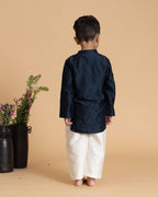 laad`s kid in marine blue kurta with embroideret  details on placket, paired  with off white trousers