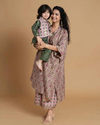 Phulwari's kaftan: V-neck & ambi-inspired print. Delicate embroidery, sleeve details. Flowing checkered palazzos. Comfy & stylish perfect festive wear