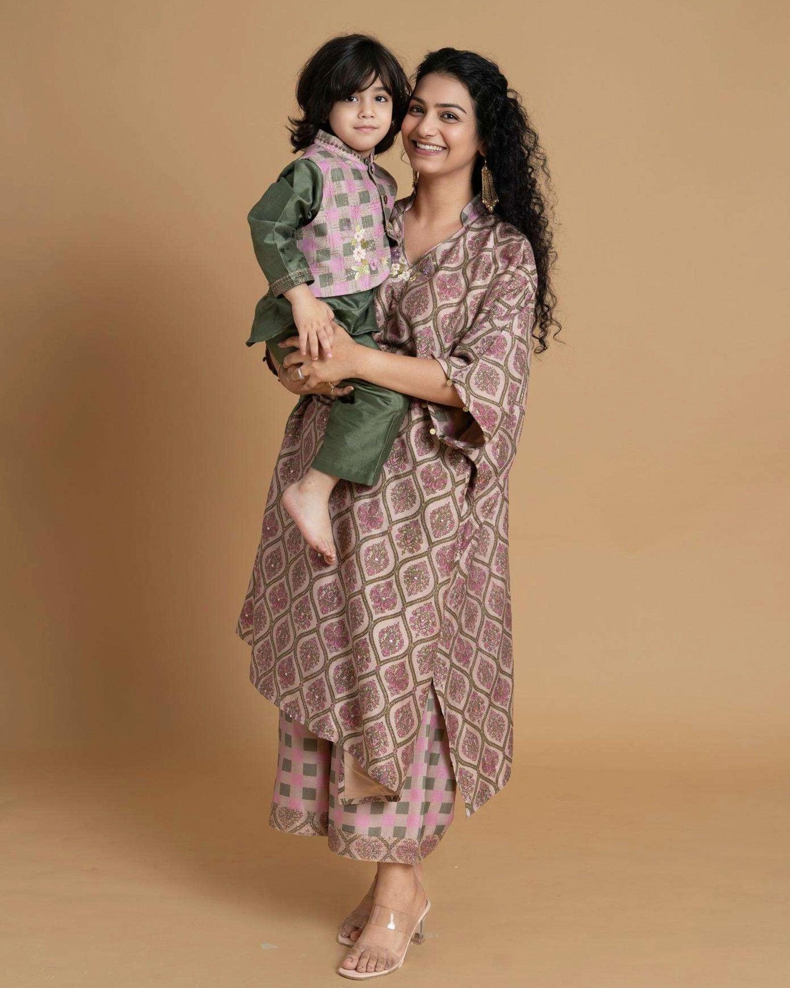 Phulwari's kaftan: V-neck & ambi-inspired print. Delicate embroidery, sleeve details. Flowing checkered palazzos. Comfy & stylish perfect festive wear