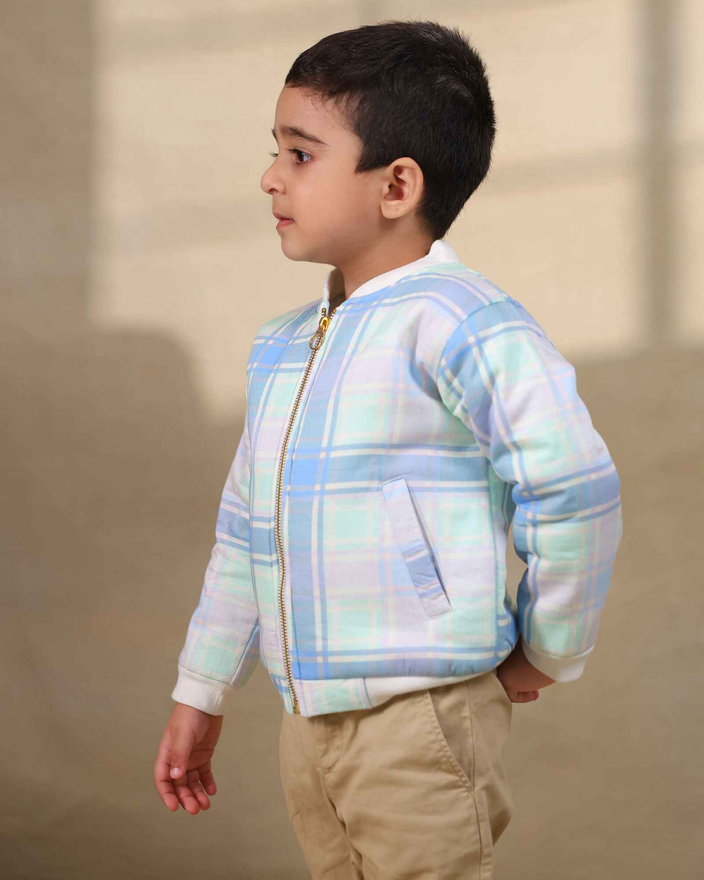 Boy kid wearing plaid check bomber jacket in soft cotton , perfect winter wear .
