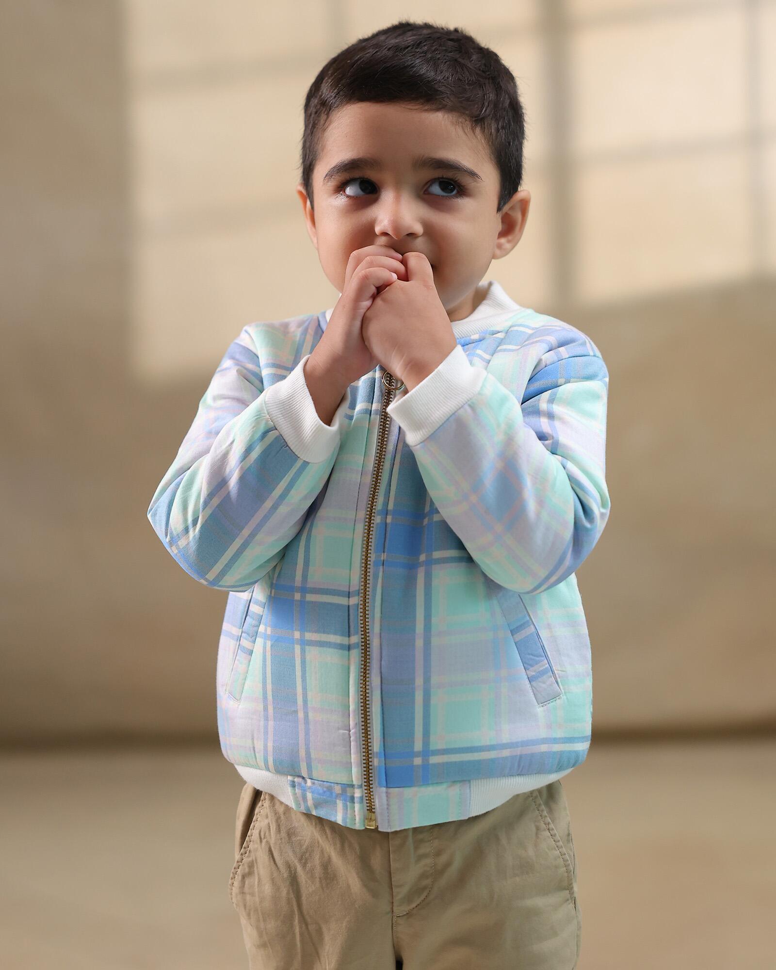 Boy kid wearing plaid check bomber jacket in soft cotton , perfect winter wear .