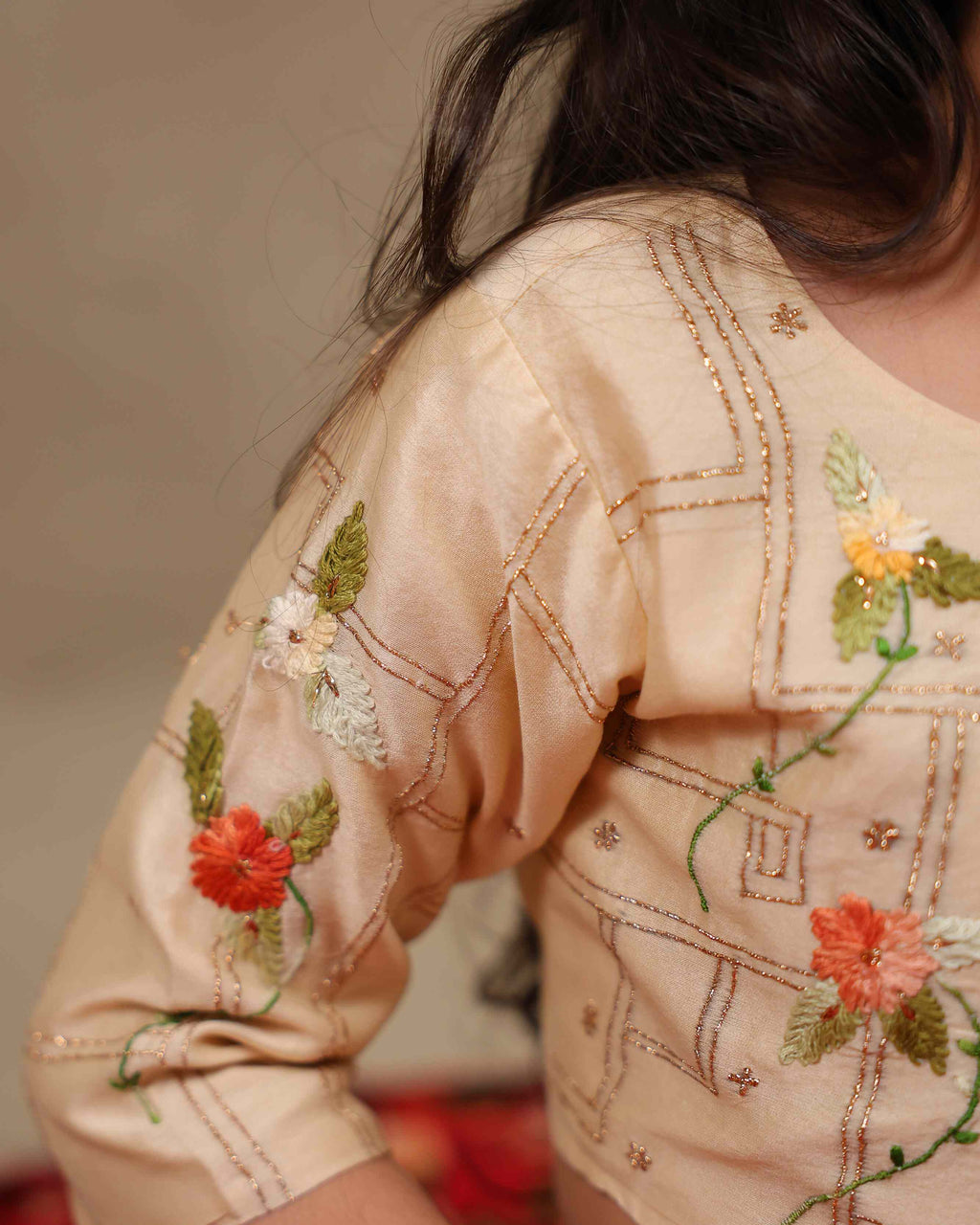 Young girl wearing LAAD’s  floral red rose lehenga set with embroidered perfect net lehenga choli with dupatta girls festive wear for kids, perfect for weddings and celebrations.