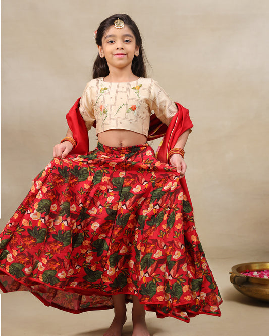 Young girl wearing LAAD’s floral red rose lehenga set with embroidered blouse and dupatta – festive ethnic wear for kids, perfect for weddings and celebrations.