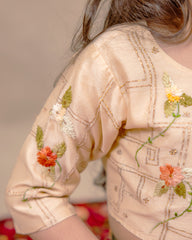 Young girl wearing LAAD’s floral red rose lehenga set with embroidered blouse and dupatta – festive ethnic wear for kids, perfect for weddings and celebrations.