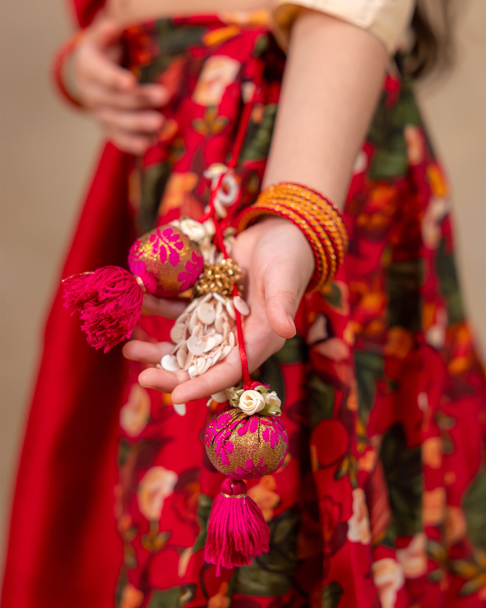Young girl wearing LAAD’s floral red rose lehenga set with embroidered blouse and dupatta – festive ethnic wear for kids, perfect for weddings and celebrations.